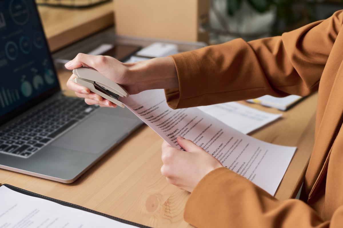 Professional woman sorting documents